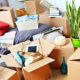 Packed moving boxes and household items ready for removal