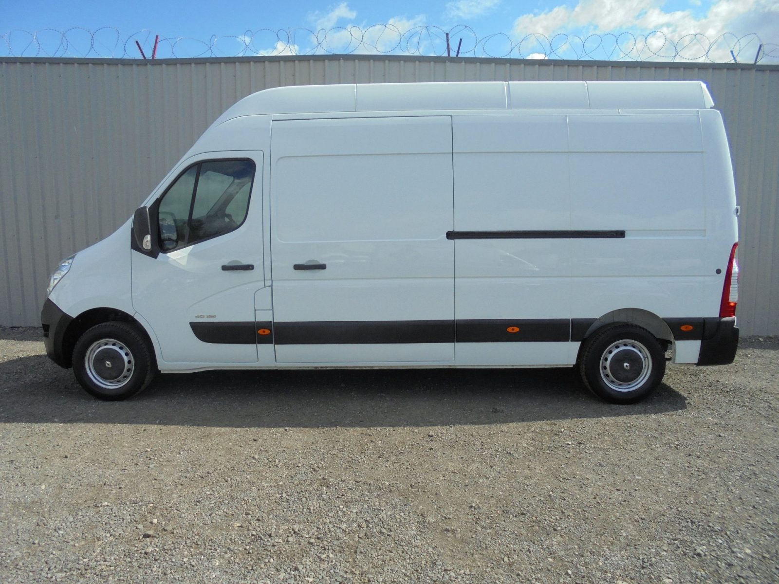 White high-roof removals van, side view